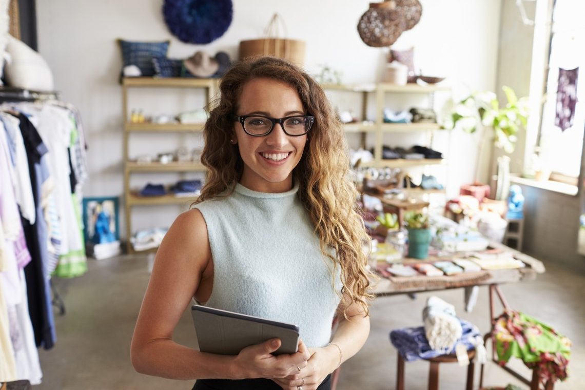 Business owner smiling in her shop